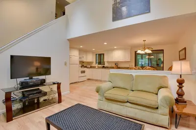 a living room with a couch and a tv at Deck and Fire Pit Pocono Lake Home Near Skiing! in Pocono Lake