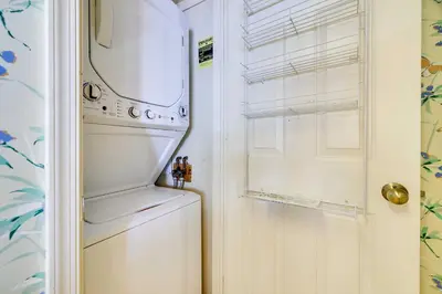 a washer and dryer in a kitchen with a refrigerator at 1 Mi to Big Boulder Lakefront Unit with Pool Access in Lake Harmony
