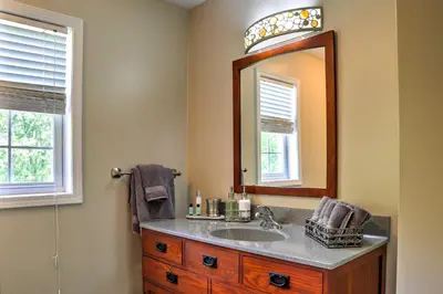 a bathroom with a sink and a mirror at Colonial-Style Warwick Retreat - 1 Hour to NYC! in Warwick