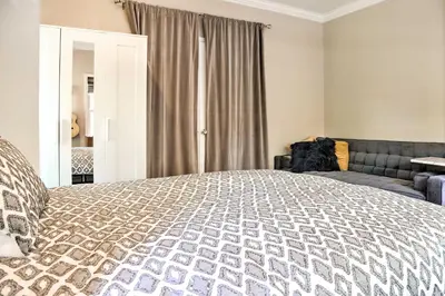 a bedroom with a bed and a couch at Colonial-Style Warwick Retreat - 1 Hour to NYC! in Warwick