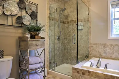 a bathroom with a shower and a toilet and a sink at Colonial-Style Warwick Retreat - 1 Hour to NYC! in Warwick