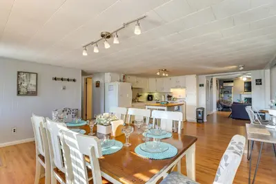 a dining room and kitchen with a table and chairs at Happy Place by the Lake with Fire Pit Walk to Beach in Pocono Lake