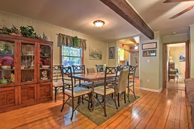 a dining room with a table and chairs at 1 Mi to Lake Wallenpaupack Pocono Mountain Home! in Greentown