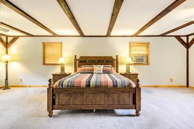 a bedroom with a bed and two lamps in it at Thompson Home with Deck and Pond, 8 Mi to Elk Mountain in Thompson