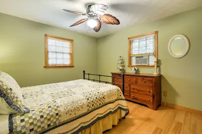 a bedroom with a bed and a ceiling fan at Thompson Home with Deck and Pond, 8 Mi to Elk Mountain in Thompson