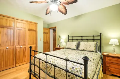 a bedroom with a bed and a ceiling fan at Thompson Home with Deck and Pond, 8 Mi to Elk Mountain in Thompson