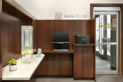 an office with a desk with a computer on it at Courtyard by Marriott New York Manhattan/Chelsea in New York