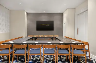 a large conference room with a large table and chairs at Courtyard by Marriott New York Manhattan/Chelsea in New York