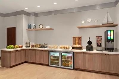 a kitchen with a counter with a refrigerator at Fairfield Inn by Marriott New York Manhattan/Financial District in New York