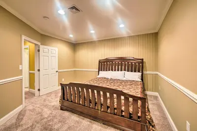 a bedroom with a wooden bed in a room at Extravagant Atglen Manor with Private 60-Acre Land! in Atglen