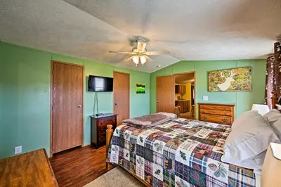 a bedroom with a bed and a ceiling fan at 180-Acre Farm The Lodge in Klingerstown! in Klingerstown