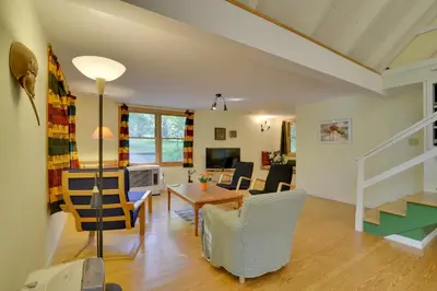 a dining room and living room with a table and chairs at Secluded Stroudsburg Home - 5 Mi to Ski Resort in Stroudsburg