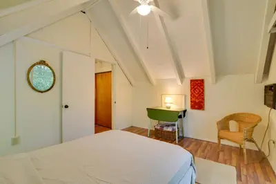 a bedroom with a white bed and a desk at Secluded Stroudsburg Home - 5 Mi to Ski Resort in Stroudsburg