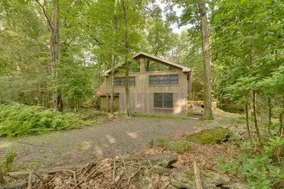 a house in the middle of the woods at Secluded Stroudsburg Home - 5 Mi to Ski Resort in Stroudsburg