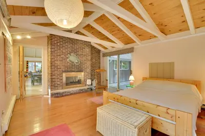 a bedroom with a bed and a fireplace at Secluded Stroudsburg Home - 5 Mi to Ski Resort in Stroudsburg