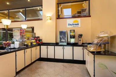 a fast food restaurant with white cabinets and a counter at Days Inn by Wyndham Hillsborough in Hillsborough
