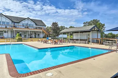 a large swimming pool in front of a house at Pools, Hot Tub and More Bushkill Mountain Getaway! in Sandyville