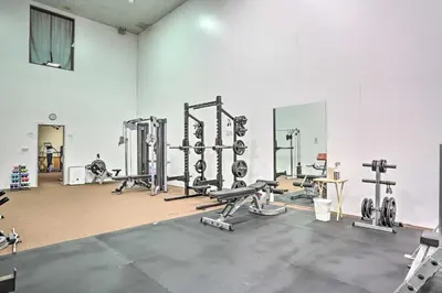 a gym with lots of equipment in a room at Pools, Hot Tub and More Bushkill Mountain Getaway! in Sandyville