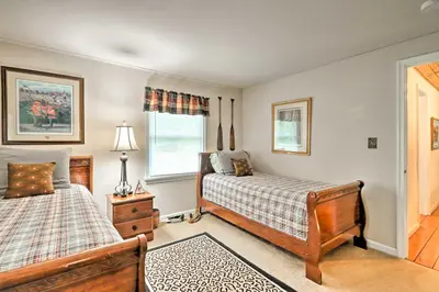 a bedroom with two beds and a window at Relaxing Eagle Rock Resort Home - 1 Block to Lake! in Hazleton