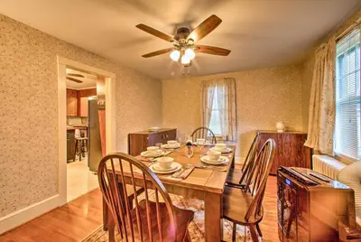 a dining room with a table with chairs and a ceiling fan at Whimsical Lancaster Home - 4 Mi to Sight and Sound in Lancaster