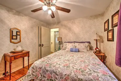 a bedroom with a bed and a ceiling fan at Whimsical Lancaster Home - 4 Mi to Sight and Sound in Lancaster