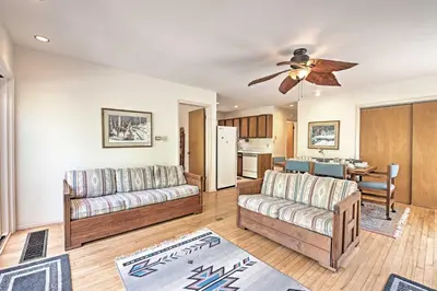 a living room with two couches and a ceiling fan at Creekside Arrowhead Lake House with Dock and Canoe! in Pocono Lake