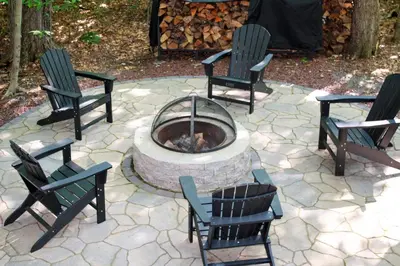a group of chairs sitting around a fire pit at Pocono Lake House Near Skiing and Kalahari Resort! in Pocono Lake