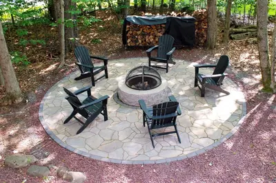 a group of chairs sitting around a fire pit at Pocono Lake House Near Skiing and Kalahari Resort! in Pocono Lake