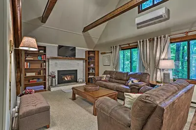 a living room with two couches and a fireplace at Pocono Lake House Near Skiing and Kalahari Resort! in Pocono Lake