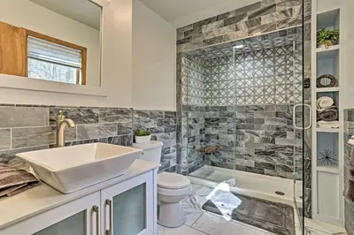 a bathroom with a sink and a shower at Pocono Lake Paradise with Private Beach and Dock! in Pocono Lake