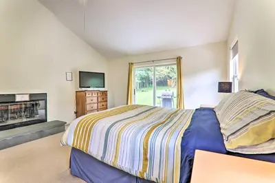 a bedroom with a bed and a tv and a fireplace at Private Dog-Friendly Home 3 Mi to Elk Mountain in Union Dale