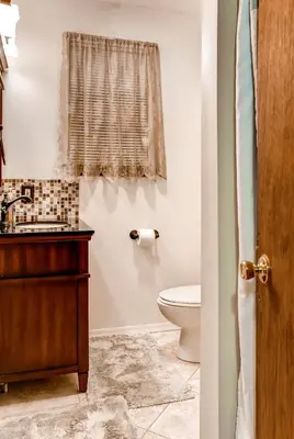 a bathroom with a toilet and a sink at Lake Harmony Vacation Rental with Hot Tub and Views! in Lake Harmony