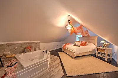 a childs bedroom with a bed and a tub at Cottage with Hot Tub and Fire Pit By Mahantango Creek in Dalmatia