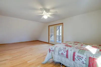 a bedroom with a bed and a ceiling fan at Benton Home on 50 Acres with Private Deck and Views! in Benton