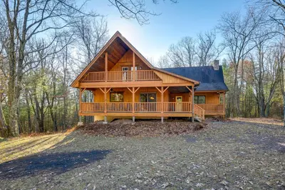 a large wooden house with a large deck at Benton Home on 50 Acres with Private Deck and Views! in Benton