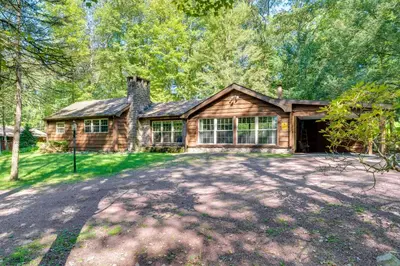 a house with a large driveway in front of it at 3 Mi to Slopes! Hot Tub Haven Near Lake Harmony in Lake Harmony