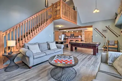 a living room with a couch and a pool table at Near Lake and Hiking Pocono Home with Hot Tub in Albrightsville