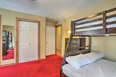 a bedroom with a bunk bed and a closet at Cozy Retreat with Deck and Hot Tub, 20 mins to Kalahari in Tobyhanna