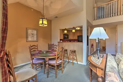 a kitchen and dining room with a table and chairs at Mountain Creek Resort Home - Hot Tub and Pool Access in Vernon Township