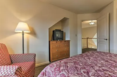 a bedroom with a bed and a tv on a dresser at Mountain Creek Resort Home - Hot Tub and Pool Access in Vernon Township