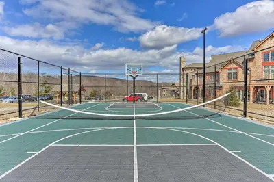 a tennis court with a basketball hoop on it at Mountain Creek Resort Home - Hot Tub and Pool Access in Vernon Township