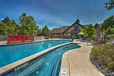 a swimming pool in front of a house at Mountain Creek Resort Home - Hot Tub and Pool Access in Vernon Township