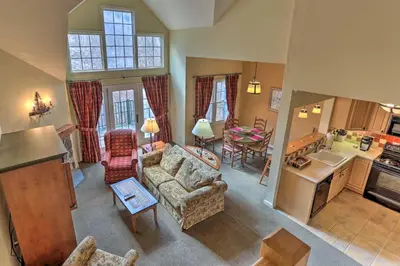 a living room with a couch and chairs and a kitchen at Mountain Creek Resort Home - Hot Tub and Pool Access in Vernon Township