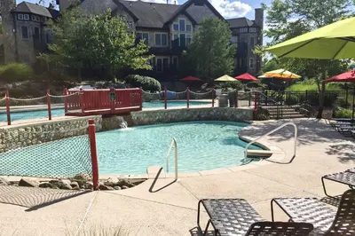 a swimming pool with a slide in a resort at Spacious Condo with View Less Than 1 Mi to Mtn Creek Resort! in Vernon Township