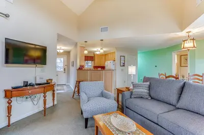a living room with a couch and a table at Spacious Condo with View Less Than 1 Mi to Mtn Creek Resort! in Vernon Township