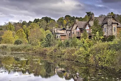 an old house on the side of a river at Spacious Condo with View Less Than 1 Mi to Mtn Creek Resort! in Vernon Township