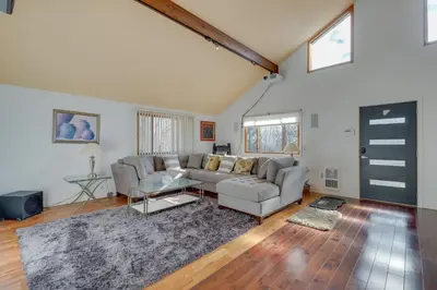a living room with a couch and a table at Cozy Pennsylvania Home with Pool Table and Pool Access in Effort