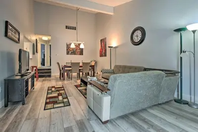 a living room with a couch and a tv at Near Mt Airy Casino Mount Pocono Condo with Balcony in Mount Pocono