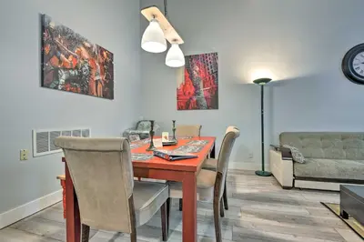 a dining room with a table and chairs at Near Mt Airy Casino Mount Pocono Condo with Balcony in Mount Pocono
