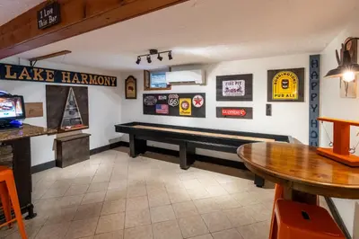 a room with a ping pong table and a bench at 2 Mi to Big Boulder Mtn Family Ski Gem on 1 Acre! in Lake Harmony
